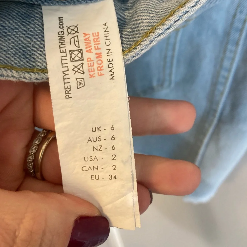 PrettyLittleThing Chain Detail Denim Mini Skirt with raw hem US Size 2